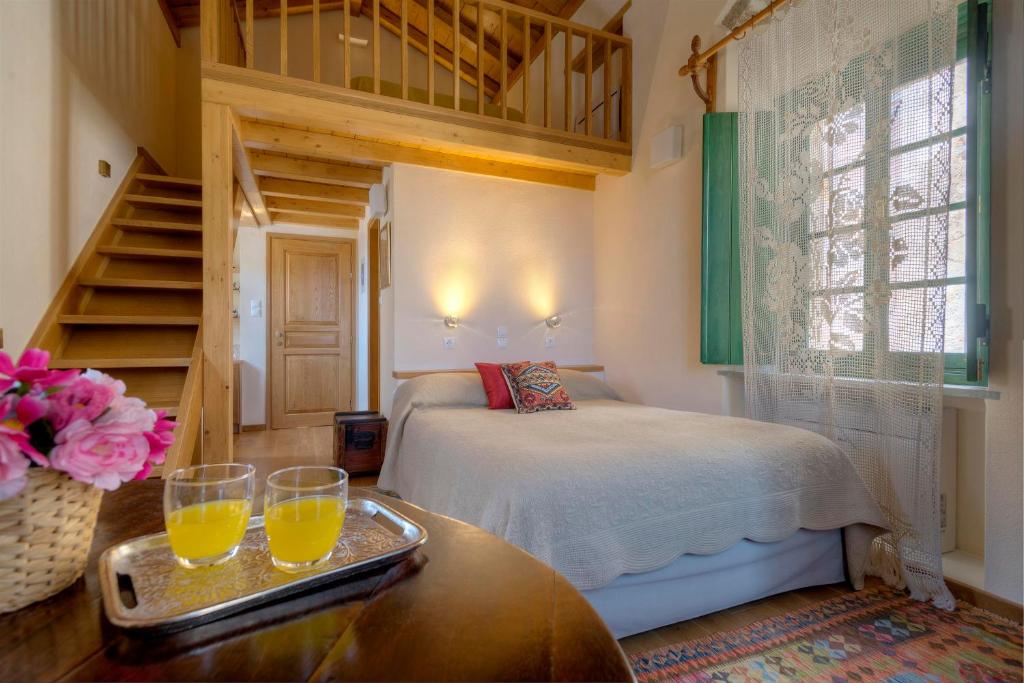 Postel nebo postele na pokoji v ubytování Ritsos Guesthouse