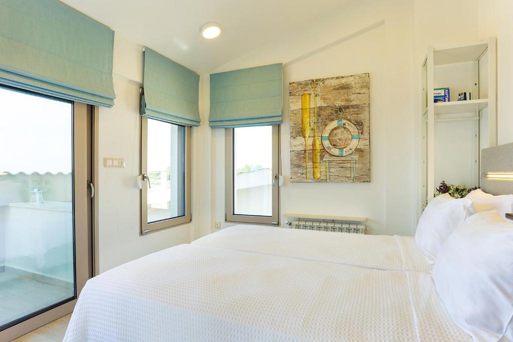 Posteľ alebo postele v izbe v ubytovaní A&A Luxury Beach Villas