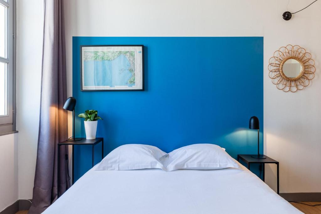 Cama ou camas em um quarto em Les Cocons - 8 appartements &agrave; 100m du Vieux Port
