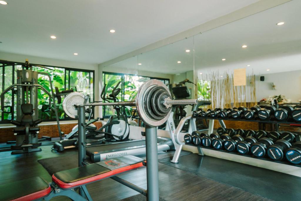 A compact, well-equipped gym with free weights and cardio machines.