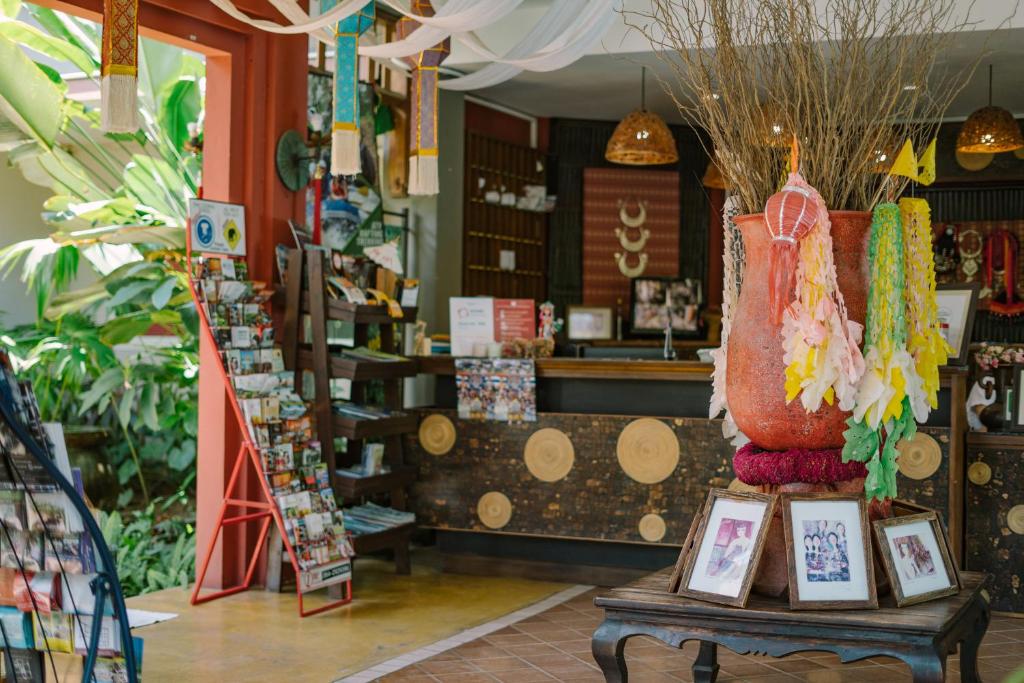A boutique-style reception and shop area filled with local-style décor.