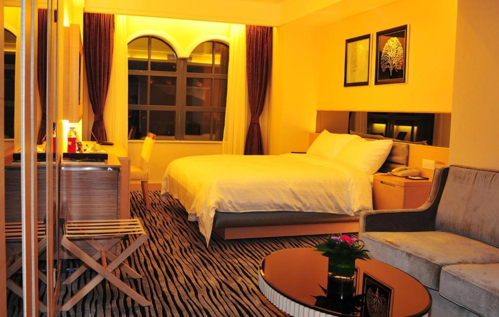 Postel nebo postele na pokoji v ubytování Shenzhen Shekou Honlux Apartment (Sea World)