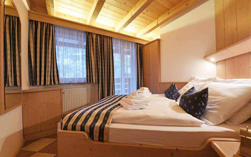Postel nebo postele na pokoji v ubytování Alpin-Residence Amadeus