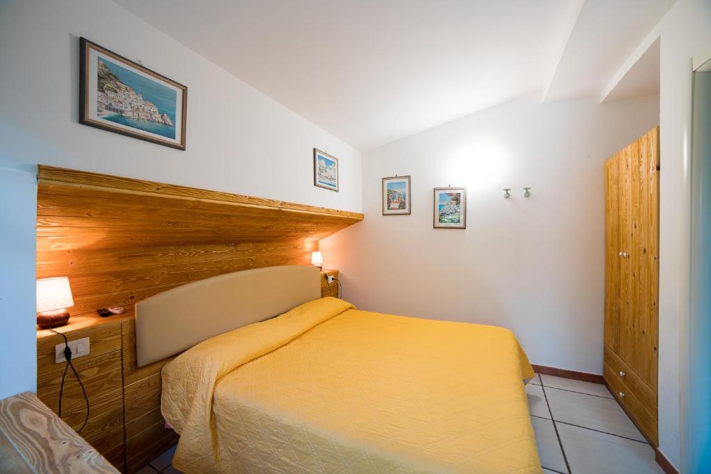 Ένα ή περισσότερα κρεβάτια σε δωμάτιο στο Il Roseto B&B