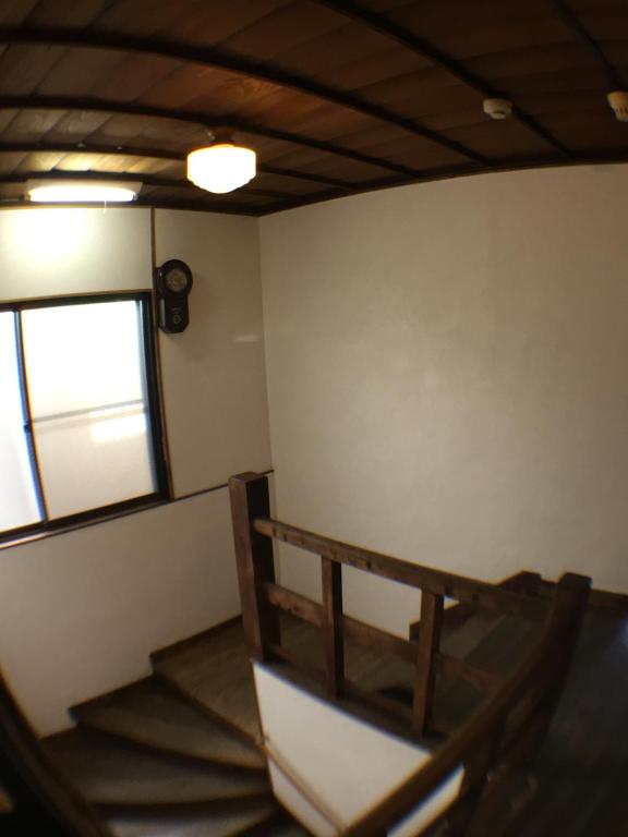 an empty room with a bench and a window at Ryokan Nakadaya in Tokyo