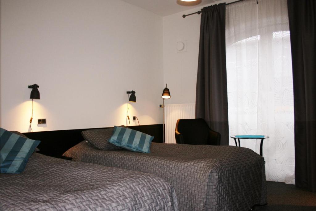 Postel nebo postele na pokoji v ubytování Taastrup Park Hotel