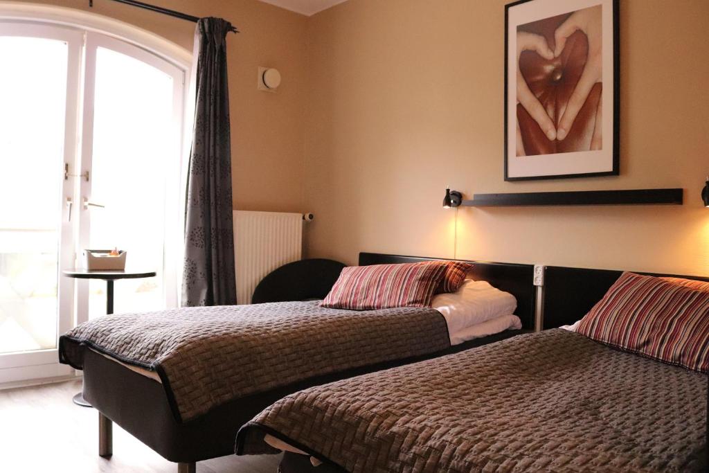 Postel nebo postele na pokoji v ubytování Taastrup Park Hotel
