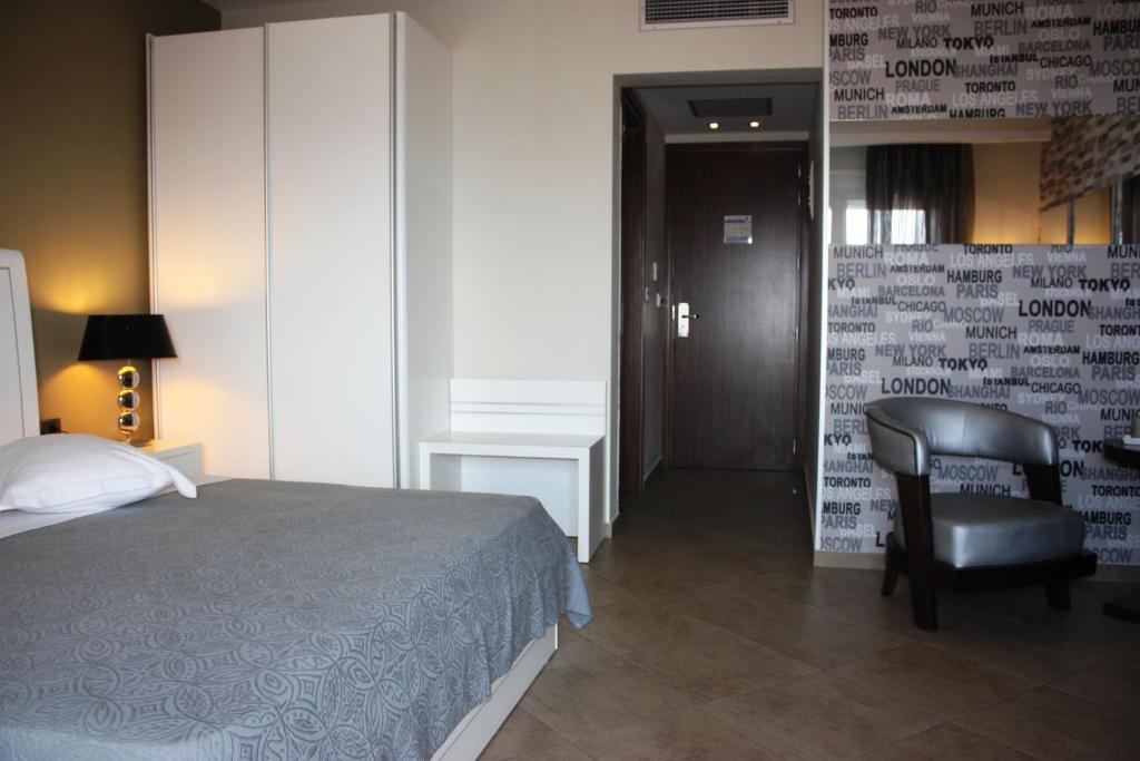 Postel nebo postele na pokoji v ubytování Hotel Cariatis