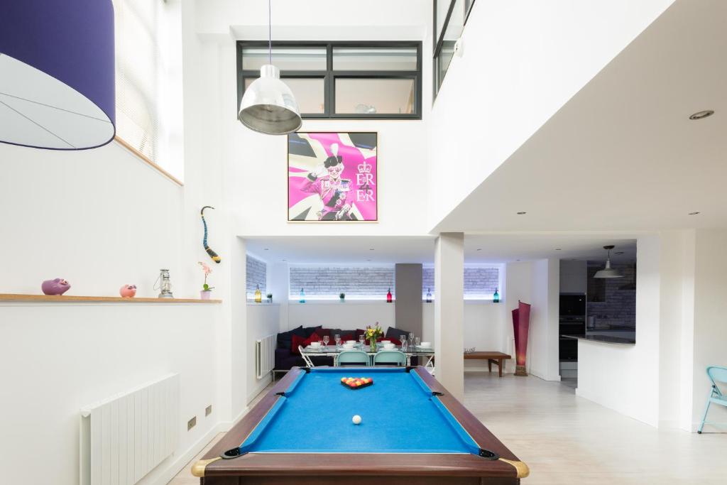 a living room with a pool table in it at Second Nest London Warehouse in London