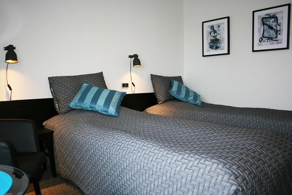Postel nebo postele na pokoji v ubytování Taastrup Park Hotel
