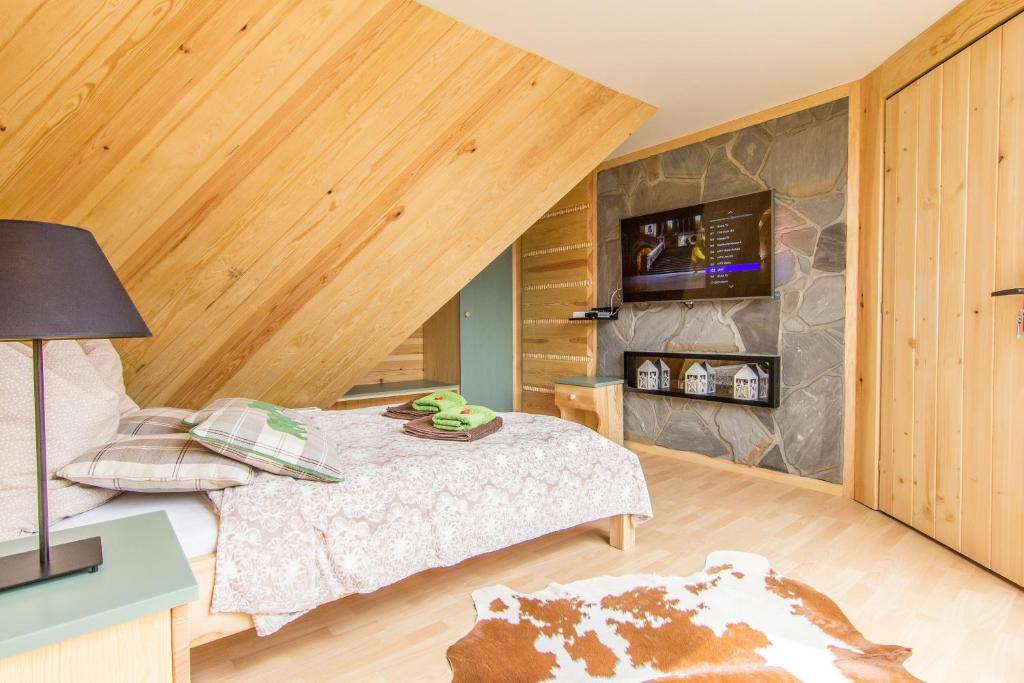 Posteľ alebo postele v izbe v ubytovaní Apartament Gawra Zakopane