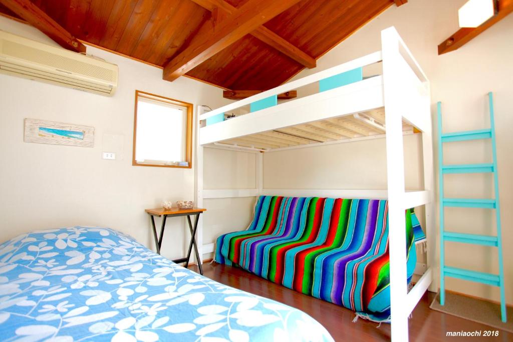 Postel nebo postele na pokoji v ubytování PavilionSurf&Lodge