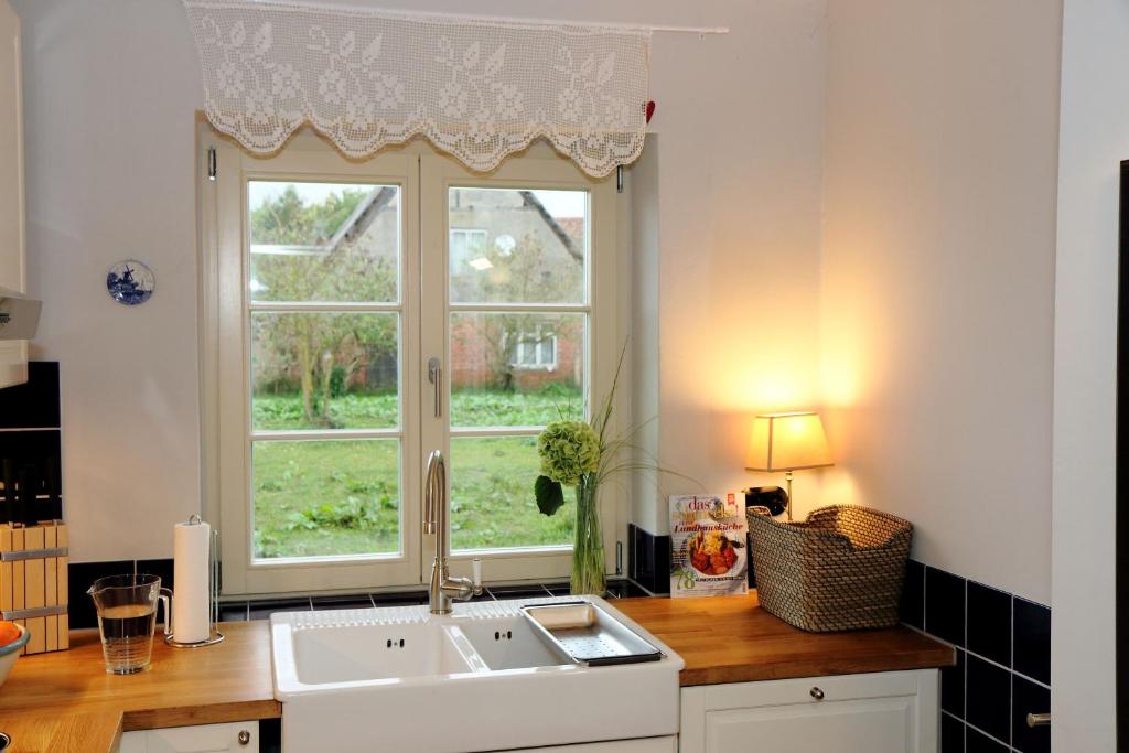 a kitchen with a sink and a window at Cottage in Buchholz