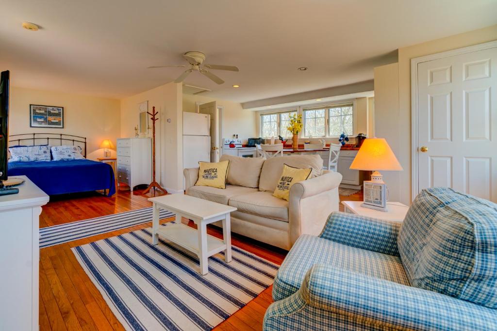 a living room with a couch and a table at Treetop in Edgartown