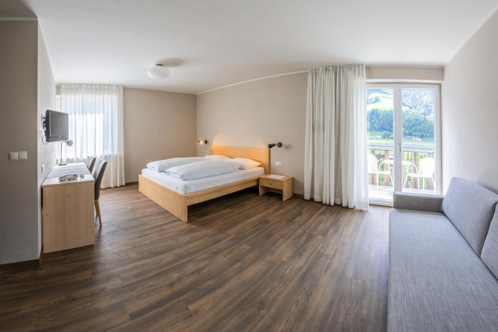 Postel nebo postele na pokoji v ubytování Hotel Untermelz