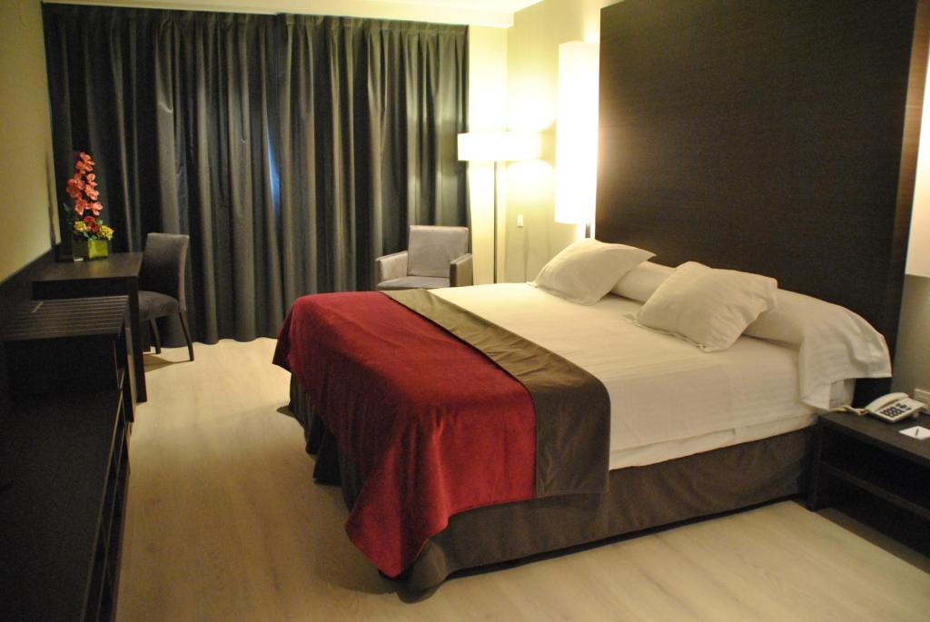 Postel nebo postele na pokoji v ubytování Brea's Hotel