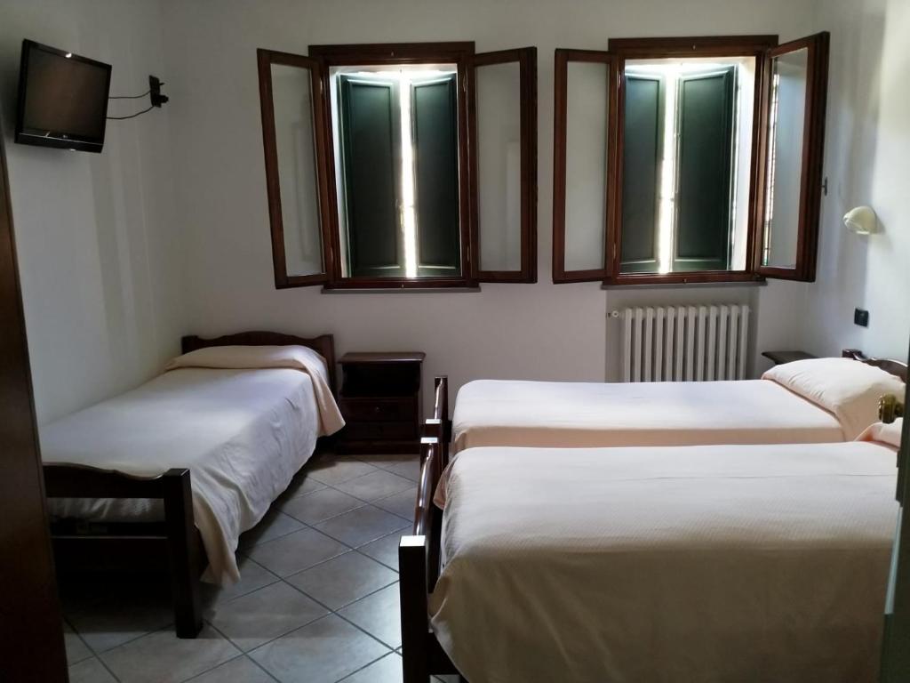 Łóżko lub łóżka w pokoju w obiekcie Acquacheta Valtancoli Hotel B&B