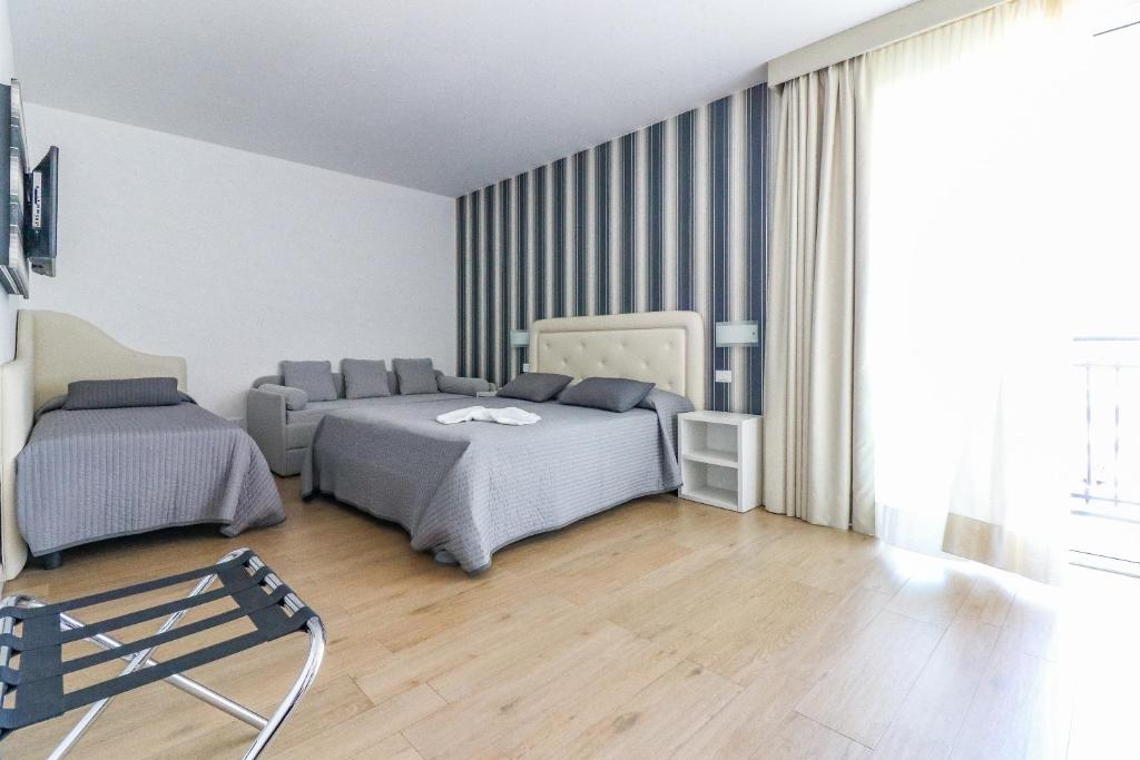 Postel nebo postele na pokoji v ubytování Hotel Jesulum