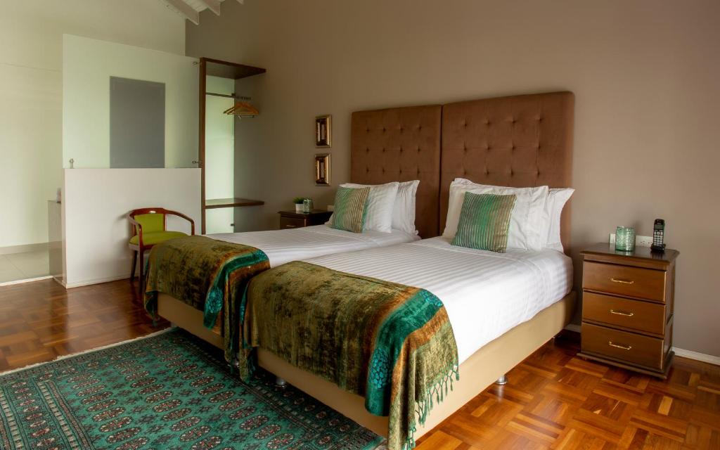 Postel nebo postele na pokoji v ubytování Hotel Boutique El Triángulo