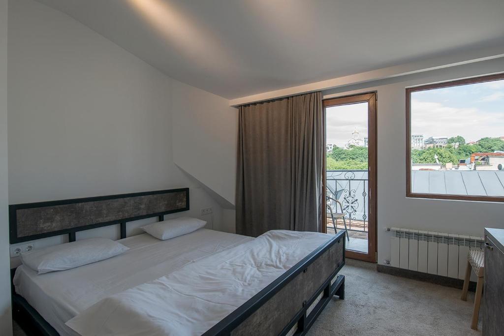 Postel nebo postele na pokoji v ubytování Hotel Opinion