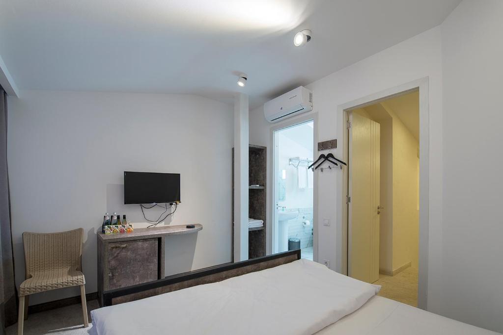 Postel nebo postele na pokoji v ubytování Hotel Opinion