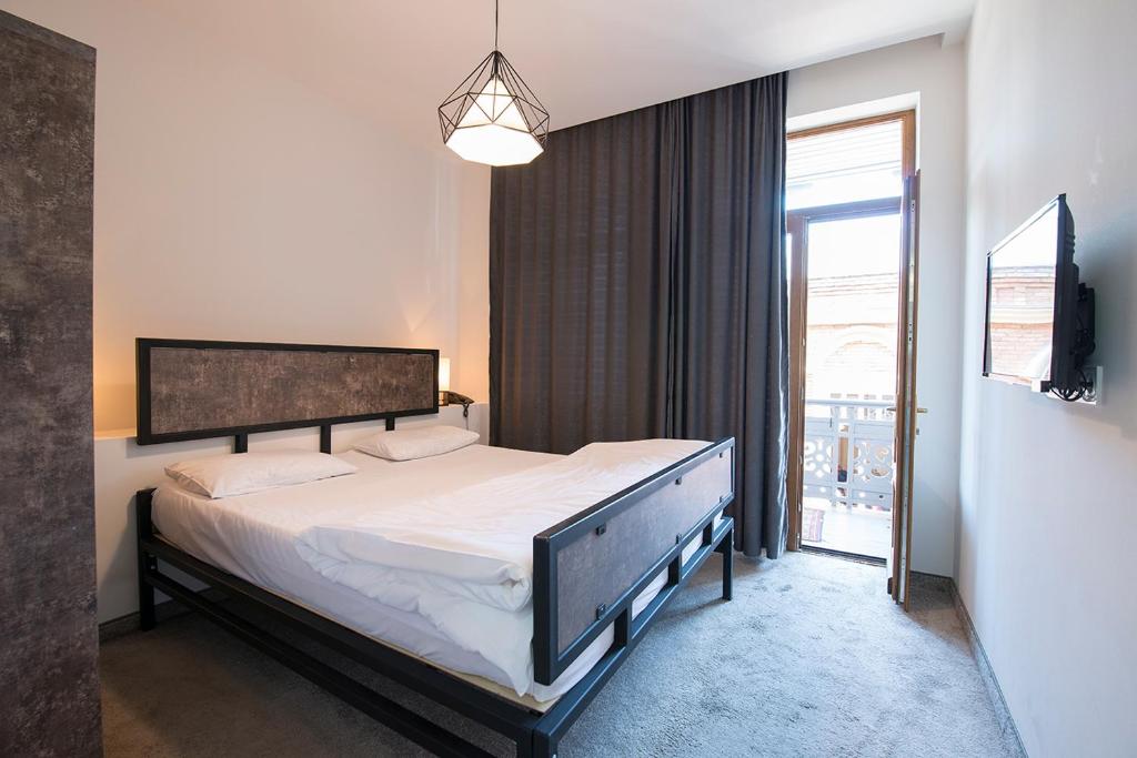 Postel nebo postele na pokoji v ubytování Hotel Opinion