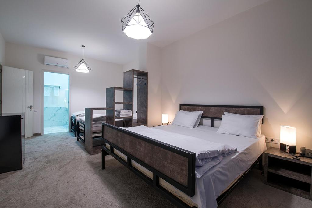 Postel nebo postele na pokoji v ubytování Hotel Opinion