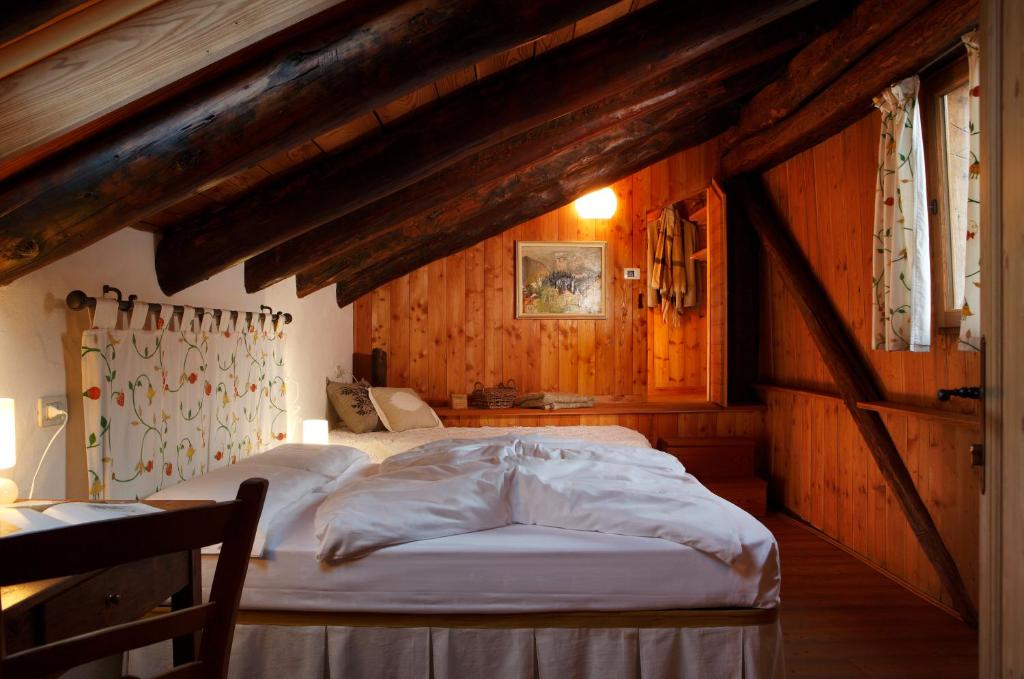 Postel nebo postele na pokoji v ubytování Dormì & Disnà