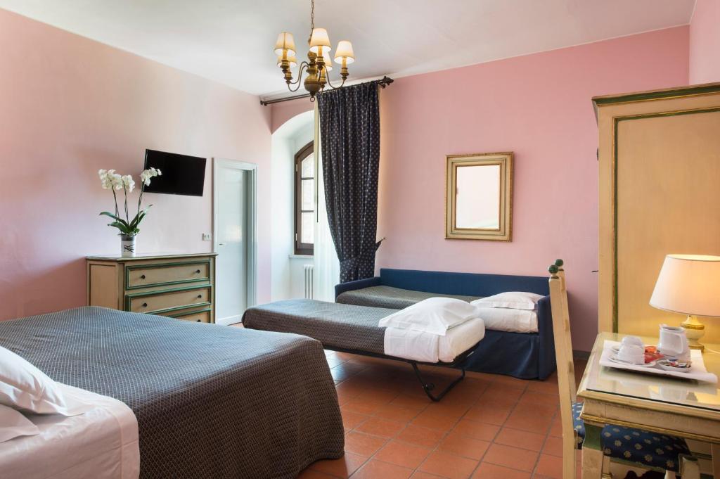Postel nebo postele na pokoji v ubytování Hotel La Cisterna