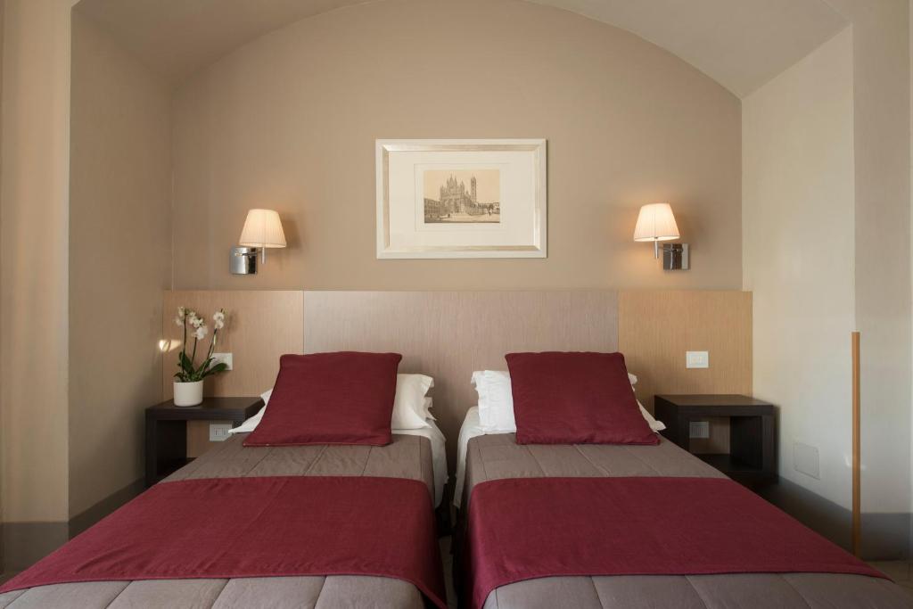 Postel nebo postele na pokoji v ubytování Hotel La Cisterna