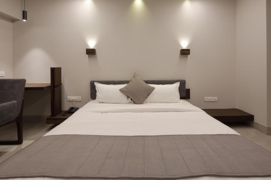 Postel nebo postele na pokoji v ubytování Hotel Carrefour
