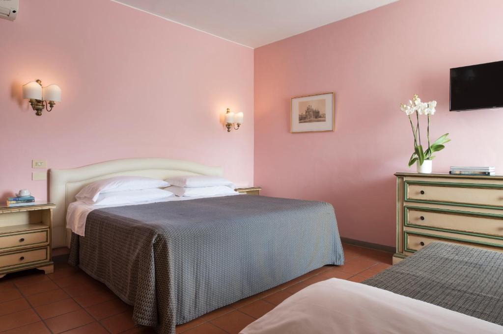 Postel nebo postele na pokoji v ubytování Hotel La Cisterna