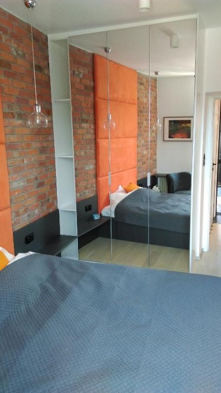 Posteľ alebo postele v izbe v ubytovaní Apartament Piwna 16 Gdańsk