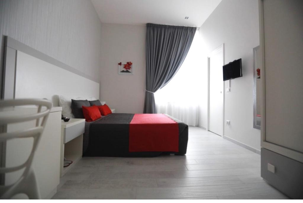 Łóżko lub łóżka w pokoju w obiekcie Chiaia Guest House
