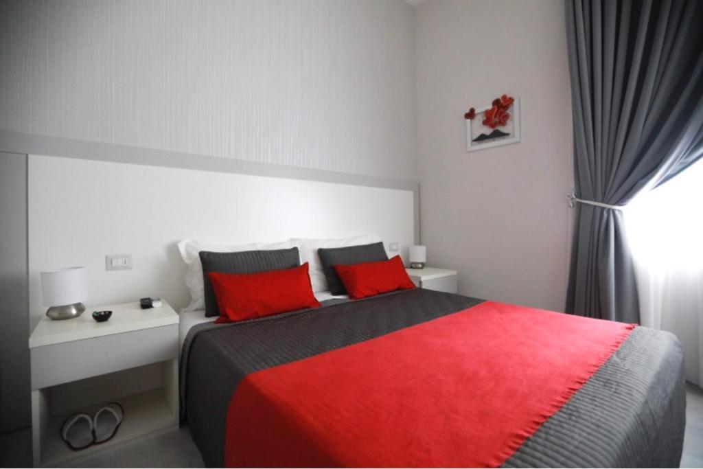 Łóżko lub łóżka w pokoju w obiekcie Chiaia Guest House