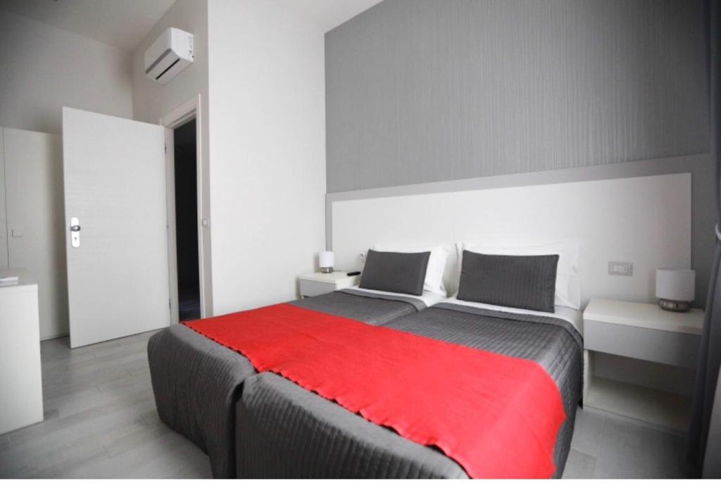 Łóżko lub łóżka w pokoju w obiekcie Chiaia Guest House