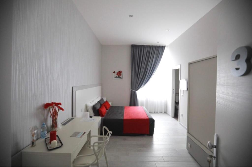 Łóżko lub łóżka w pokoju w obiekcie Chiaia Guest House