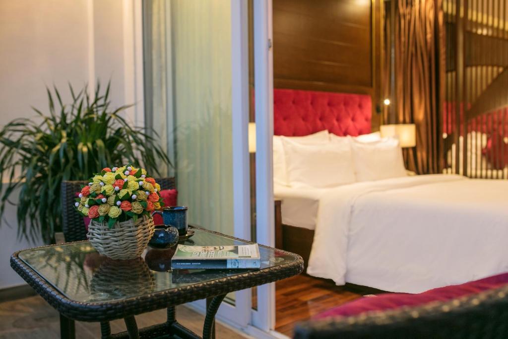 Postel nebo postele na pokoji v ubytování Sapa Horizon Hotel