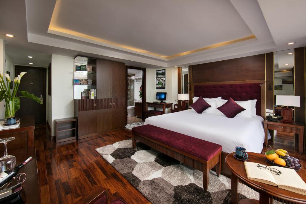 Postel nebo postele na pokoji v ubytování Sapa Horizon Hotel