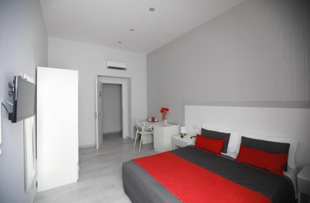 Łóżko lub łóżka w pokoju w obiekcie Chiaia Guest House