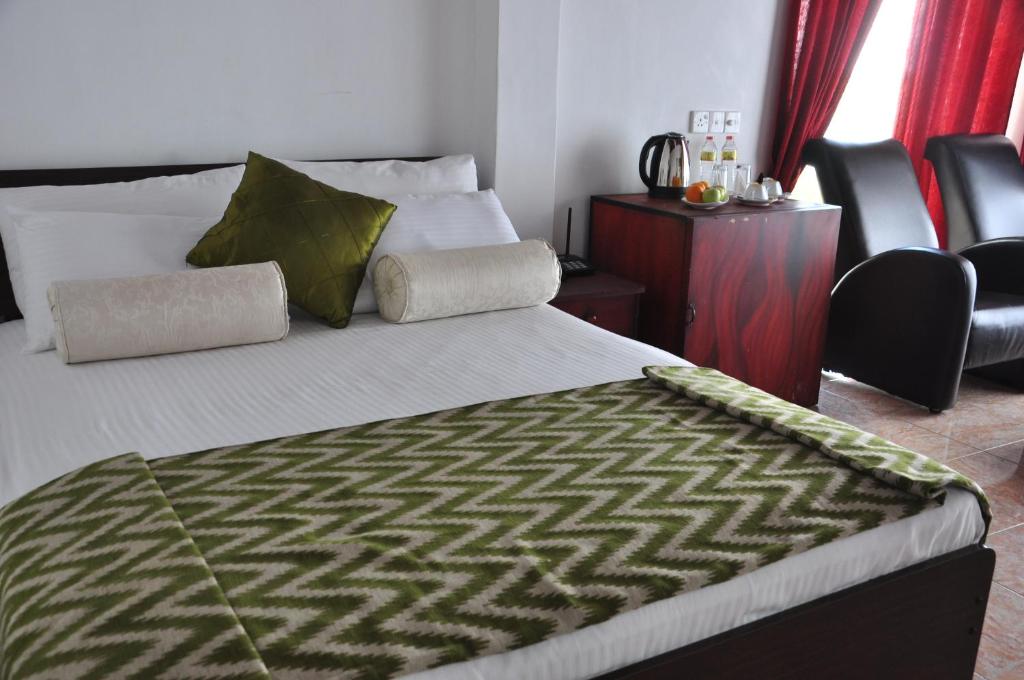 Postel nebo postele na pokoji v ubytování Villa Hotel