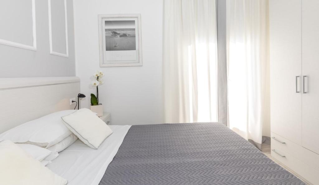 Postel nebo postele na pokoji v ubytování Hotel Plaza Esplanade