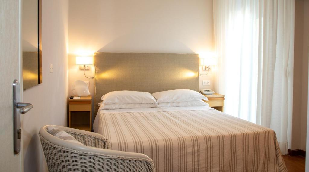 Postel nebo postele na pokoji v ubytování Hotel Plaza Esplanade