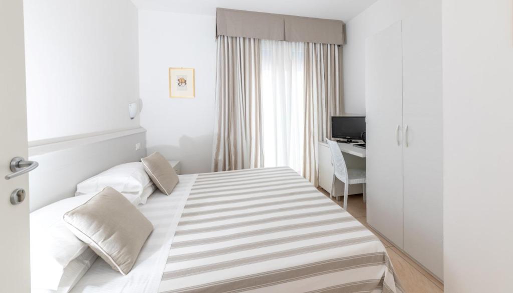Postel nebo postele na pokoji v ubytování Hotel Plaza Esplanade