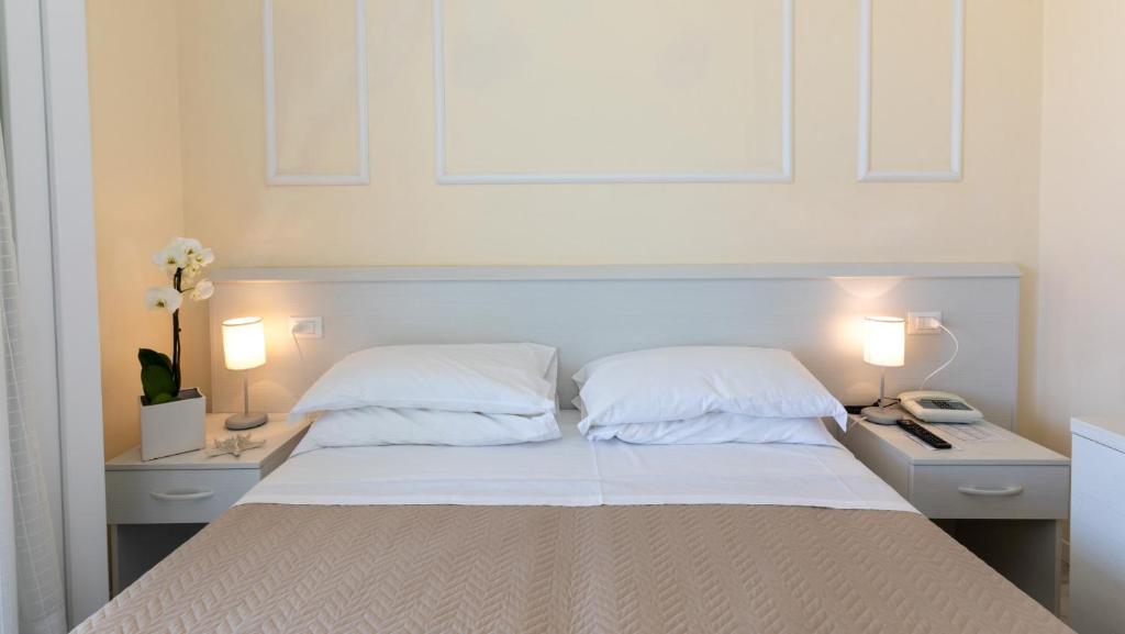 Postel nebo postele na pokoji v ubytování Hotel Plaza Esplanade
