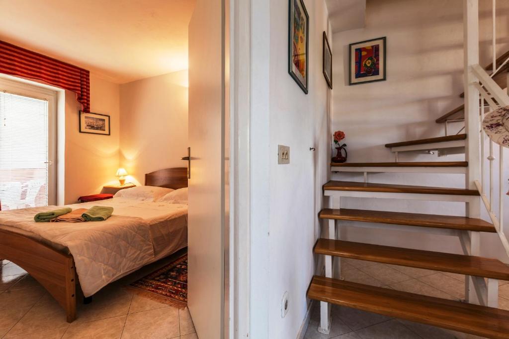 Posteľ alebo postele v izbe v ubytovaní Appartment Daniela Funtana