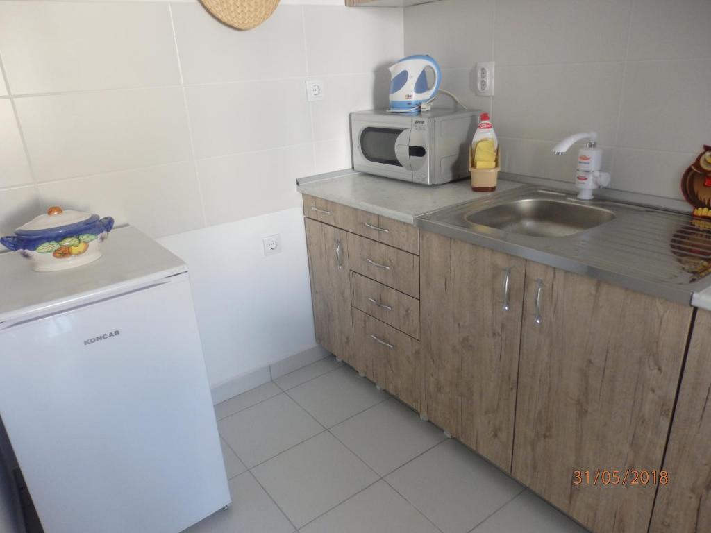 Kuchyň nebo kuchyňský kout v ubytování Apartment Erika