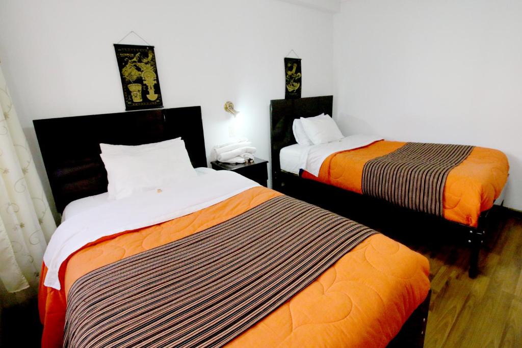 Postel nebo postele na pokoji v ubytování Hotel Peru Real