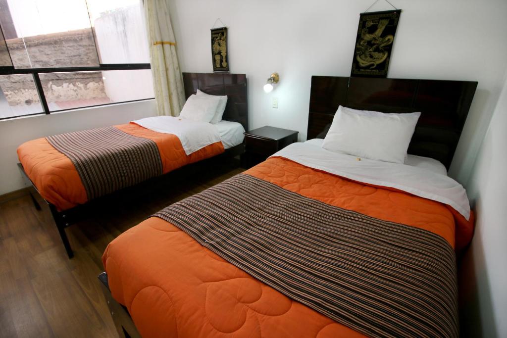 Postel nebo postele na pokoji v ubytování Hotel Peru Real