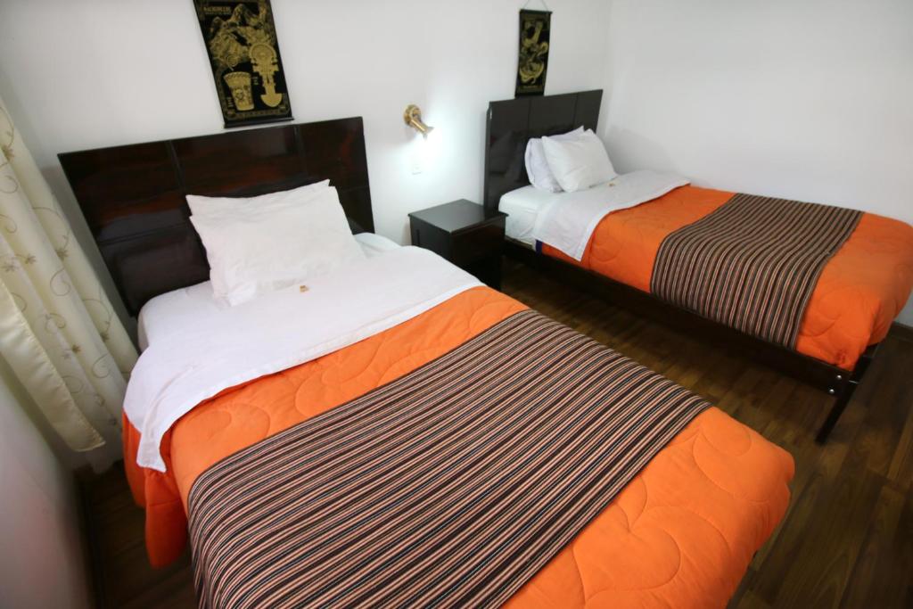 Postel nebo postele na pokoji v ubytování Hotel Peru Real